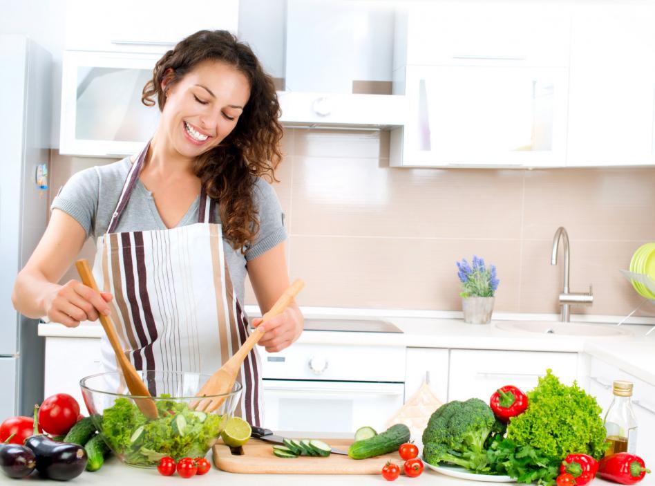 young-woman-cooking-healthy-food-vegetable-salad.jpg